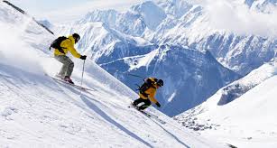 Skiing in Himachal Pradesh at Solang Valley with adventure travelers on snow-covered slopes